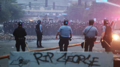 Law enforcement officers amass along Lake Street in Minneapolis, Minnesota, on May 29, 2020.