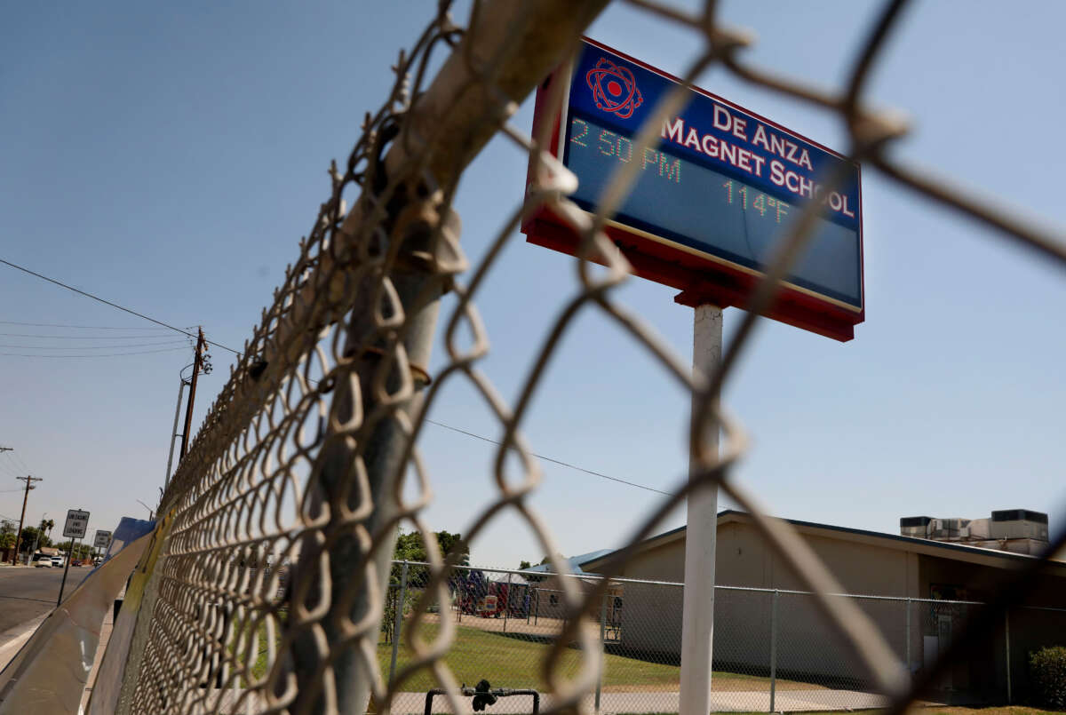 A temperature of 114 degrees Fahrenheit is displayed on a digital sign outside of De Anza Magnet School on June 12, 2022, in El Centro, California.