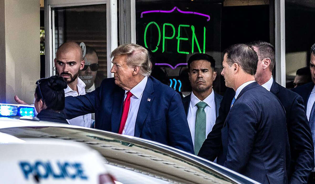 Former President Donald Trump greets supporters at Versailles Restaurant and Bakery in Little Havana after his appearance at the Miami federal courthouse, on June 13, 2023.