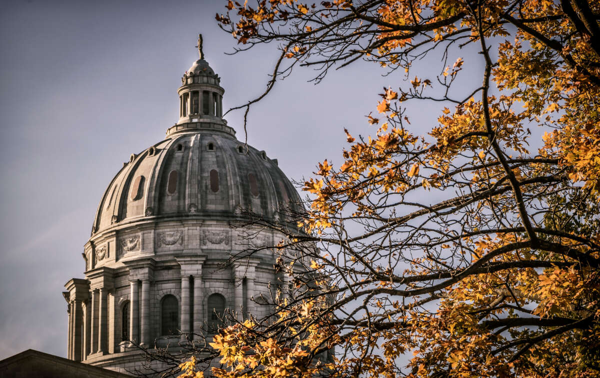 Missouri state capitol building dome with Fall leaves in foreground. Located in Jefferson City, Missouri.