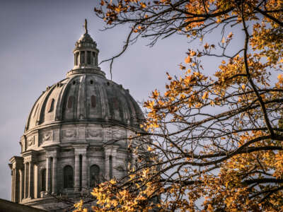 Missouri state capitol building dome with Fall leaves in foreground. Located in Jefferson City, Missouri.