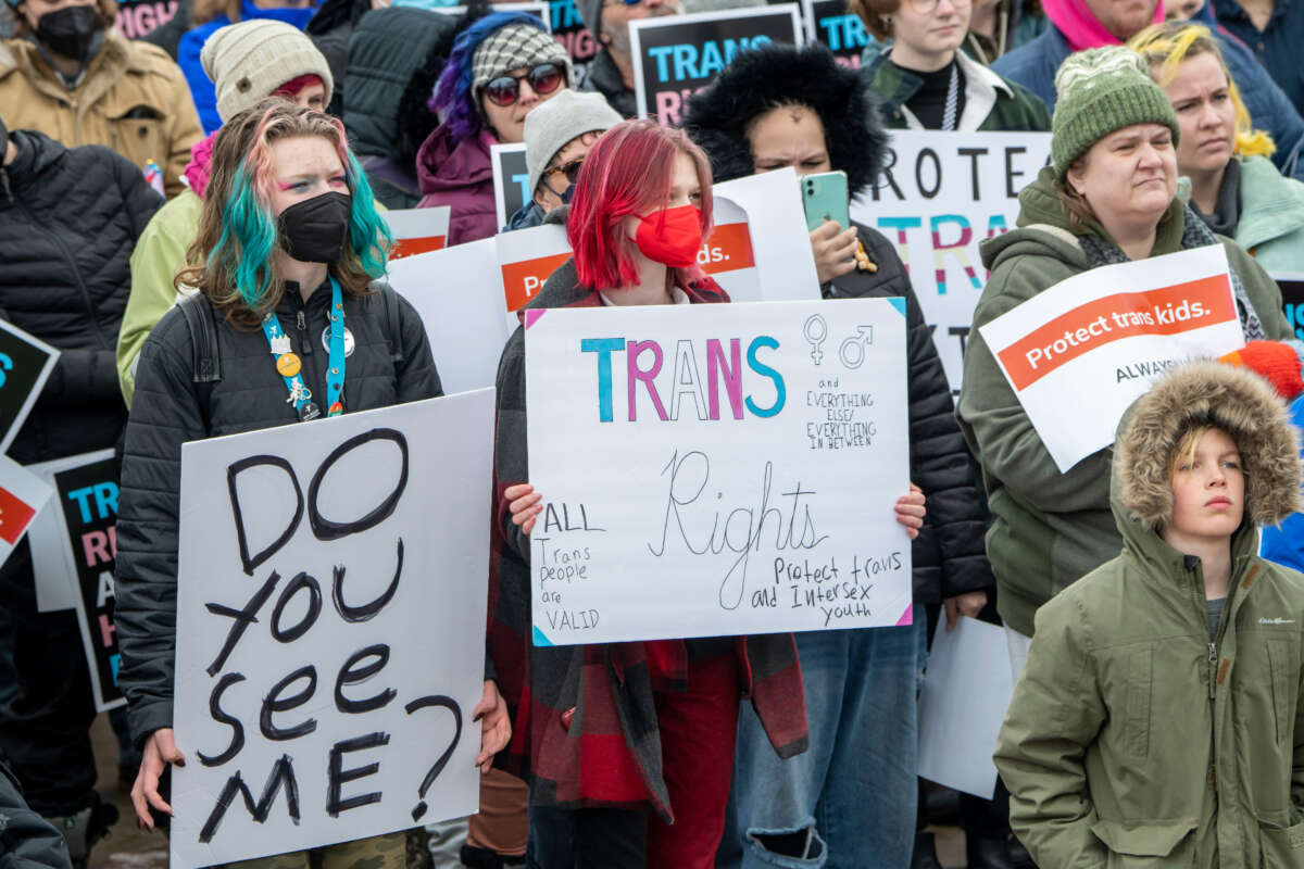People protest in support of transgender rights in St. Paul, Minnesota, on March 6, 2022.