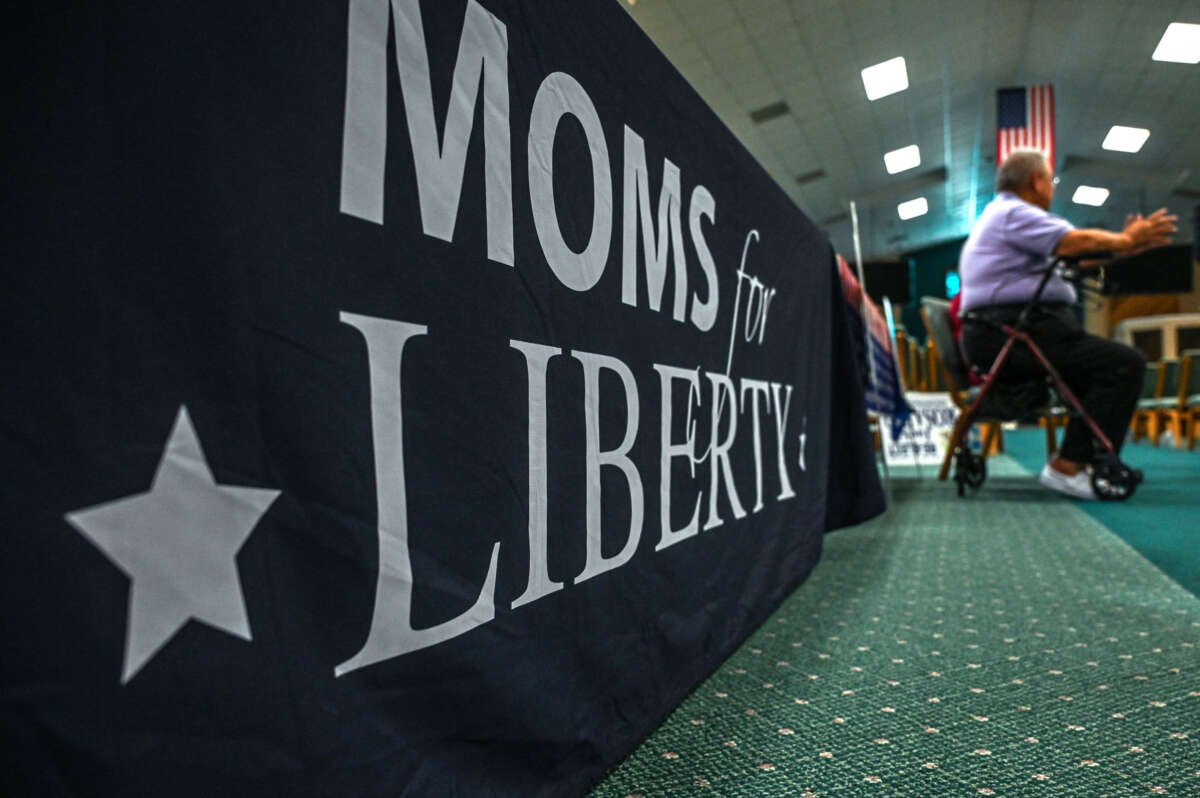 People and members of the Moms For Liberty association attend a campaign event in Vero Beach, Florida, on October 16, 2022.