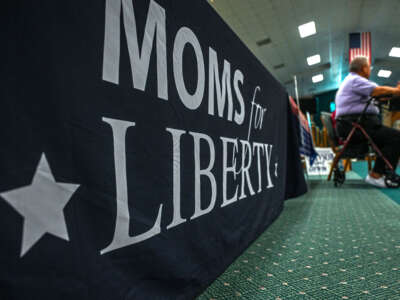People and members of the Moms For Liberty association attend a campaign event in Vero Beach, Florida, on October 16, 2022.