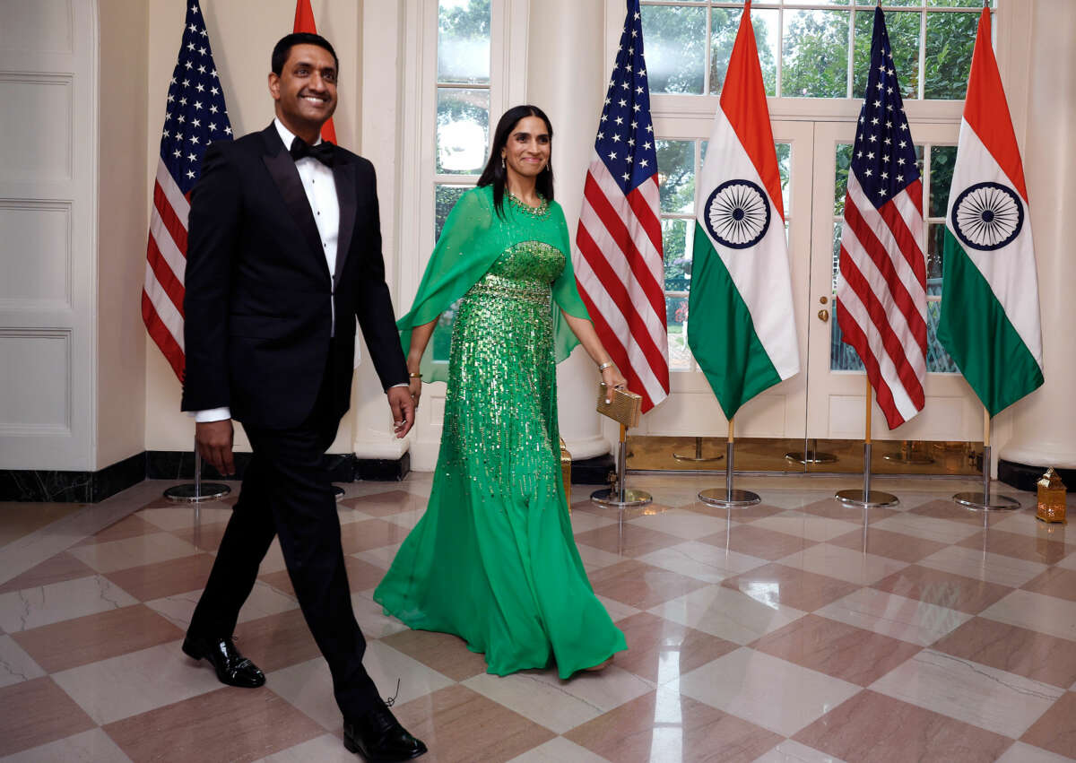 Ro Khanna enters an event holding his wife's hand