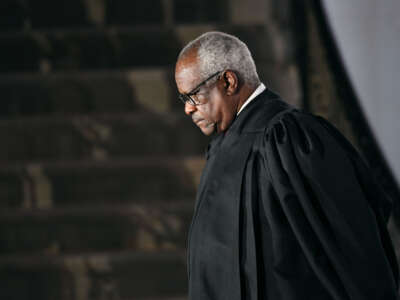 Justice Clarence Thomas swears in Judge Amy Coney Barrett as the 115th justice to the Supreme Court on October 26, 2020.