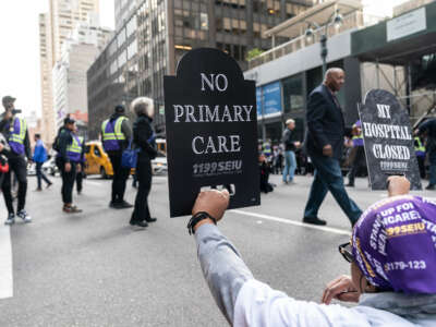 Hundreds of 1199 SEIU health care workers staged a rally and sit to block Third Avenue where some were arrested, in New York City.