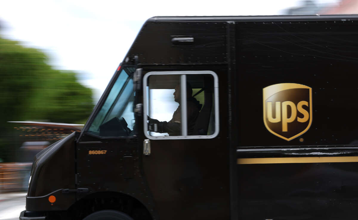 A UPS delivery truck drives through in intersection on June 12, 2023, in San Francisco, California.