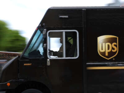 A UPS delivery truck drives through in intersection on June 12, 2023, in San Francisco, California.