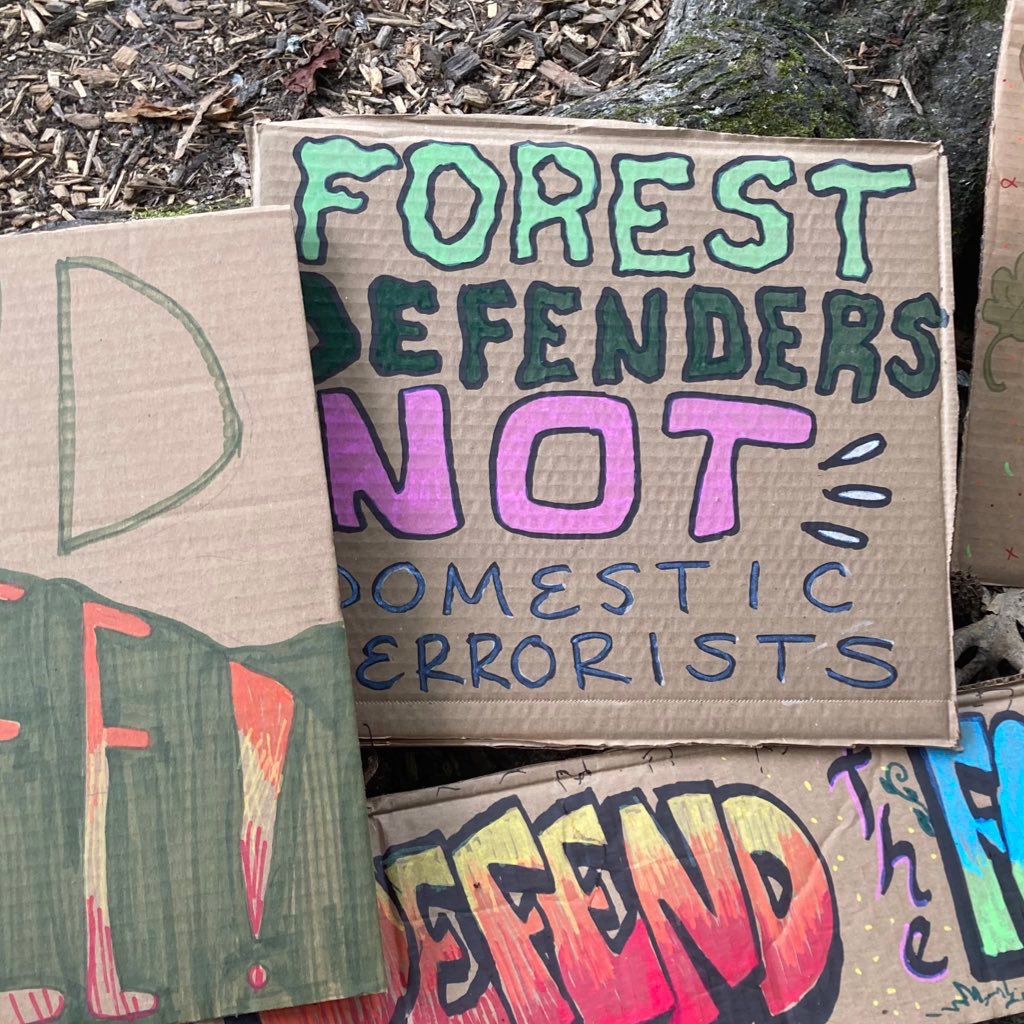 Protest signs for the Week of Action.