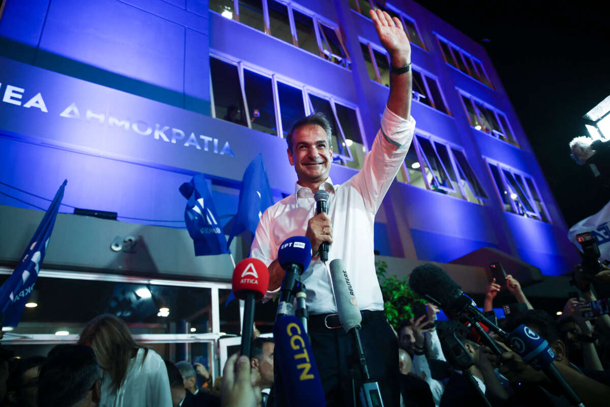 New Democracy Party leader Kyriakos Mitsotakis celebrates with fans after winning the Greek elections, on June 25, 2023.