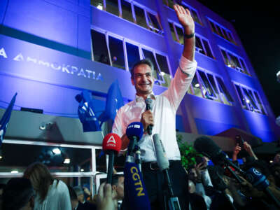 New Democracy Party leader Kyriakos Mitsotakis celebrates with fans after winning the Greek elections, on June 25, 2023.