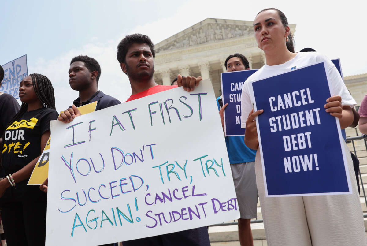 Student debt relief activists participate in a rally at the U.S. Supreme Court on June 30, 2023, in Washington, D.C.