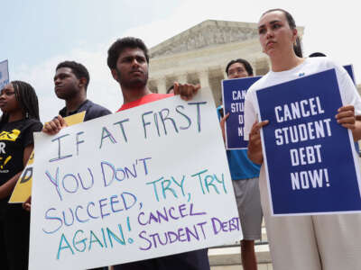 Student debt relief activists participate in a rally at the U.S. Supreme Court on June 30, 2023, in Washington, D.C.