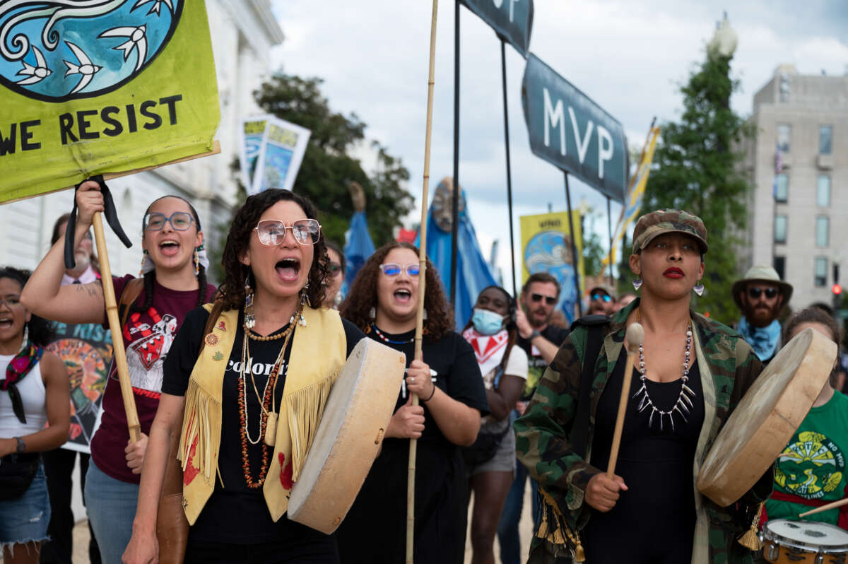 Charly Lowry (left) and Alexis Raeana (right) both of North Carolina, demonstrate with Appalachian and Indigenous climate advocates against the Mountain Valley Pipeline project approved as part of the Inflation Reduction Act in Washington, D.C. on September 8, 2022.
