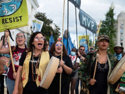 Charly Lowry (left) and Alexis Raeana (right) both of North Carolina, demonstrate with Appalachian and Indigenous climate advocates against the Mountain Valley Pipeline project approved as part of the Inflation Reduction Act in Washington, D.C. on September 8, 2022.