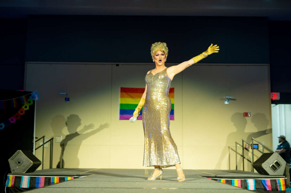 Dolly Would of western North Carolina rehearses her performance before a drag show and story hour.