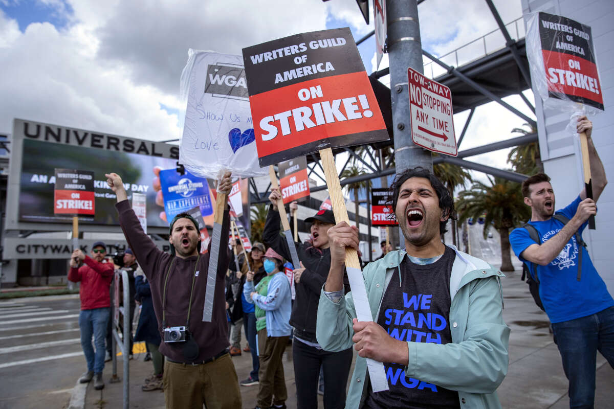 Cheech Manohar, a writer and actor, strikes with other members of the Writers Guild of America outside of NBC/Universal Studios in Universal City on May 4, 2023 in Los Angeles, California.