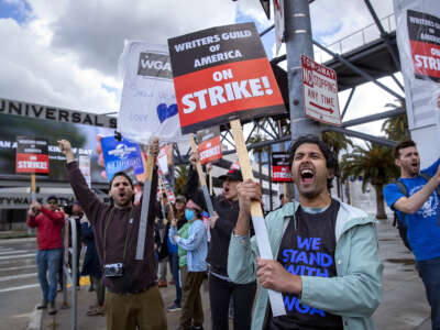 Cheech Manohar, a writer and actor, strikes with other members of the Writers Guild of America outside of NBC/Universal Studios in Universal City on May 4, 2023 in Los Angeles, California.