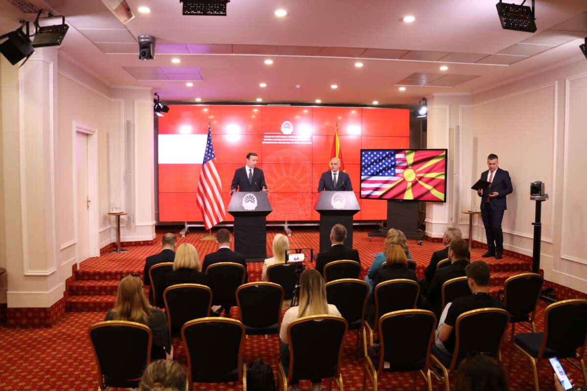 North Macedonian Prime Minister Dimitar Kovacevski and U.S. Senator Chris Murphy stand at podiums at a press conference