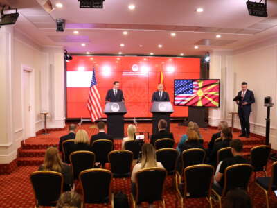 North Macedonian Prime Minister Dimitar Kovacevski and U.S. Senator Chris Murphy stand at podiums at a press conference