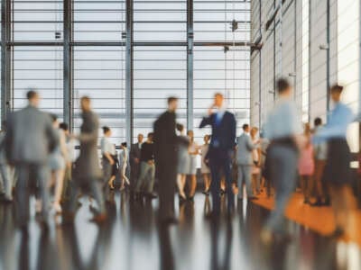 Large group of business people in convention center