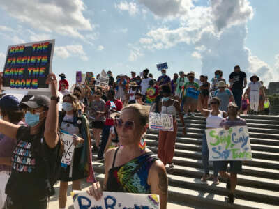 Protesters march from the capitol in Baton Rouge, Louisiana, to the governor's mansion to urge Gov. John Bel Edwards to invoke his veto powers against all anti-LGBTQ+ and anti-child bills, on May 27, 2023.