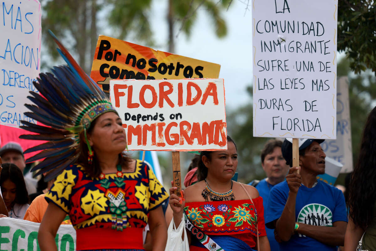 People gather together during a 'Freedom For All' rally on July 1, 2023, in Homestead, Florida. The rally was held to protest Senate Bill 1718, anti-immigrant legislation that Florida Gov. Ron DeSantis and the Florida legislators passed and become law this month.