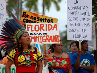 People gather together during a 'Freedom For All' rally on July 1, 2023, in Homestead, Florida. The rally was held to protest Senate Bill 1718, anti-immigrant legislation that Florida Gov. Ron DeSantis and the Florida legislators passed and become law this month.