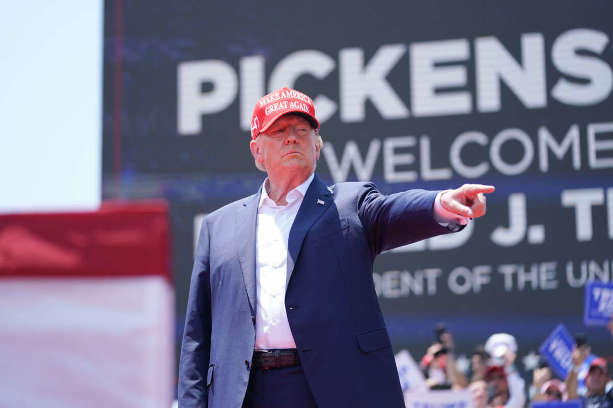 Former President Donald Trump gestures to the crowd at a campaign event on July 1, 2023, in Pickens, South Carolina.