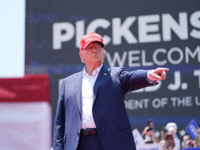 Former President Donald Trump gestures to the crowd at a campaign event on July 1, 2023, in Pickens, South Carolina.