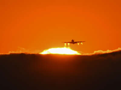 A passenger plane takes off during sunset at the San Francisco International Airport (SFO) in San Francisco as a heat wave is expected to bake California on June 30, 2023.