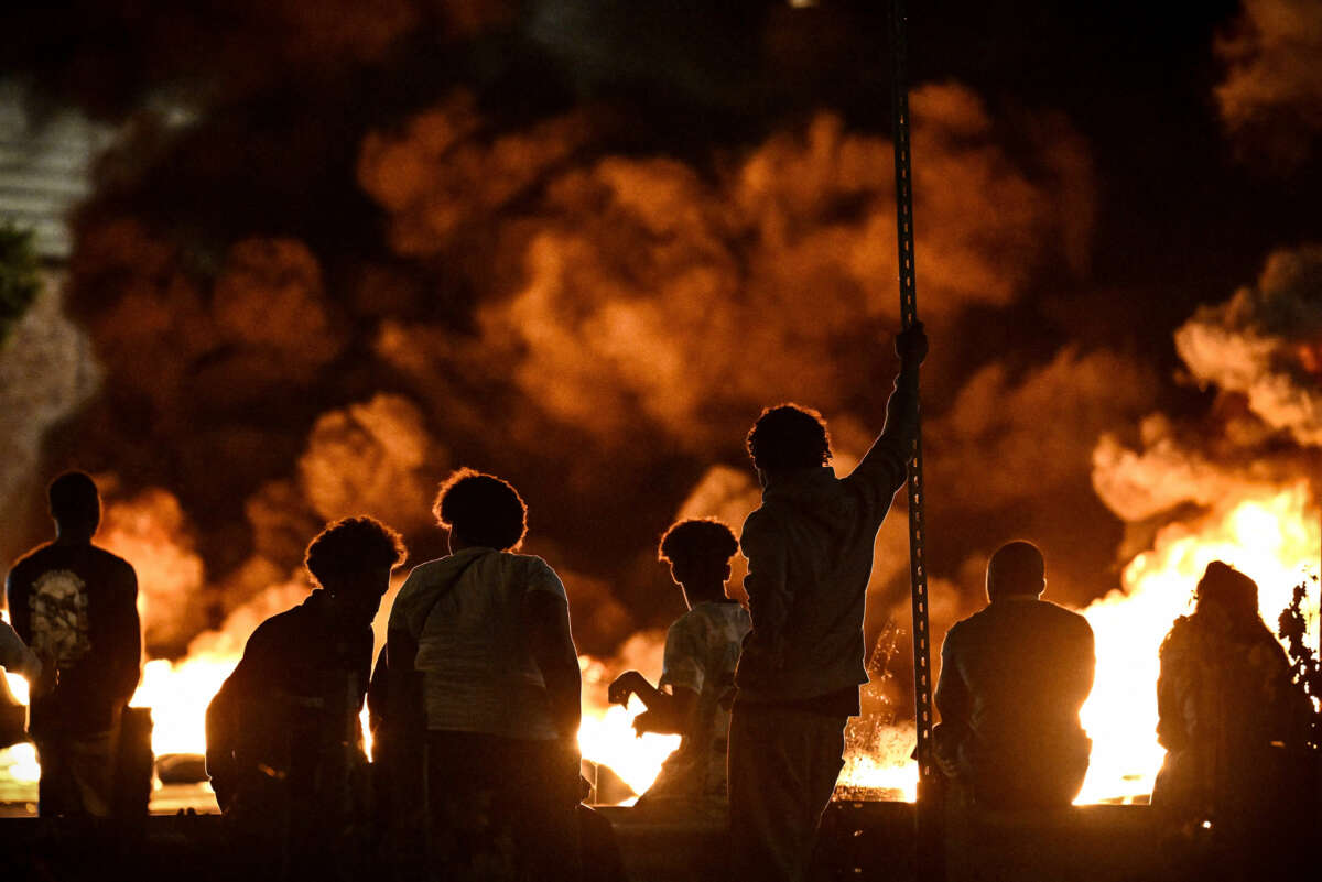 French youth of color watch Paris burn