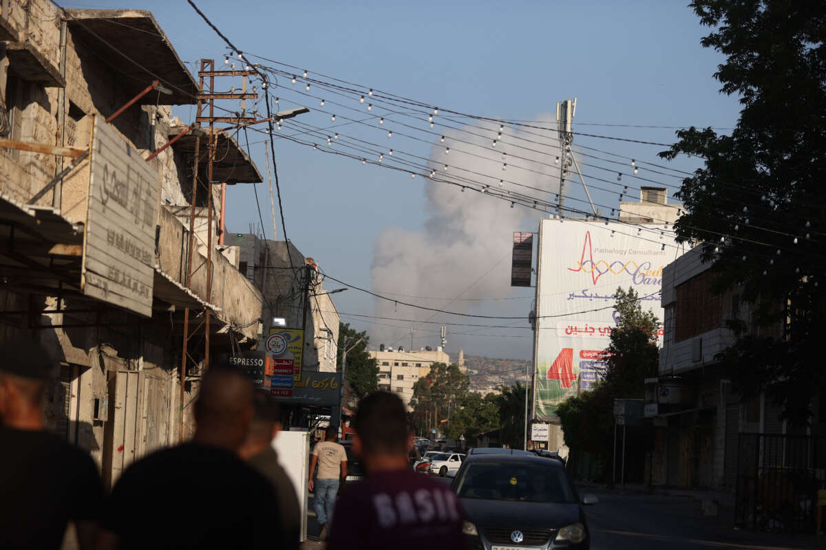 Smoke rises from the buildings after Israeli forces conducted airstrikes and raid on the city of Jenin, West Bank, on July 3, 2023.