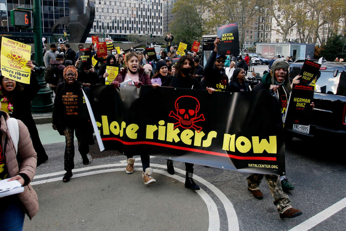 People march to the federal courthouse to demand the closure of Rikers Island on November 17, 2022, in New York City.