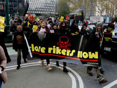 People march to the federal courthouse to demand the closure of Rikers Island on November 17, 2022, in New York City.