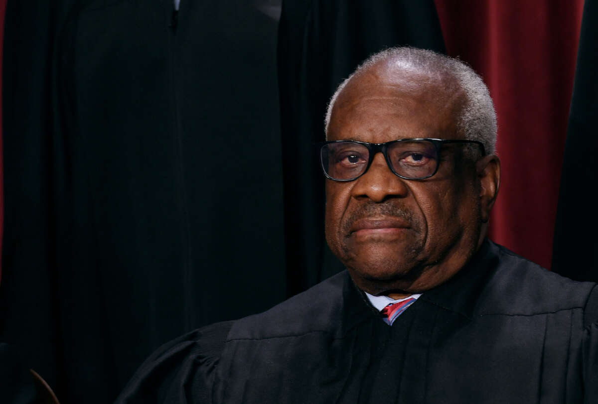 Associate Supreme Court Justice Clarence Thomas poses for the official photo at the Supreme Court in Washington, D.C., on October 7, 2022.