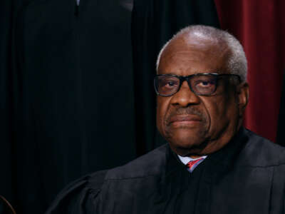 Associate Supreme Court Justice Clarence Thomas poses for the official photo at the Supreme Court in Washington, D.C., on October 7, 2022.