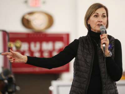 Iowa Gov. Kim Reynolds speaks at a campaign event at Dahl Auto Museum on October 31, 2020, in Davenport, Iowa.