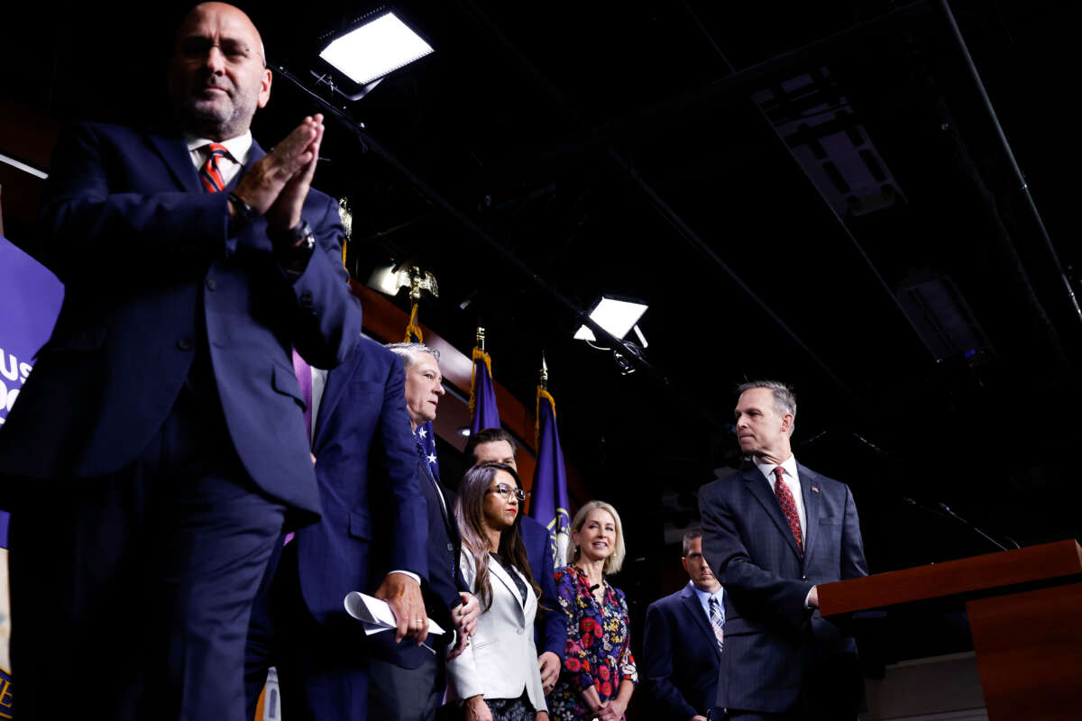 House Freedom Caucus Chairman Scott Perry looks to members of the caucus following a press conference on the National Defense Authorization Act (NDAA) on July 14, 2023, in Washington, D.C.