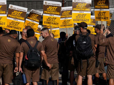 United Parcel Services (UPS) workers walk a 'practice picket line' on July 7, 2023, in the Queens borough of New York City, ahead of a possible UPS strike.