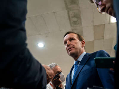 Sen. Chris Murphy speaks with reporters about ongoing negotiations regarding gun violence legislation in the Senate Subway on Capitol Hill on June 8, 2022, in Washington, D.C.