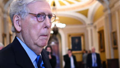 Mitch Mcconnell looks at something out of frame