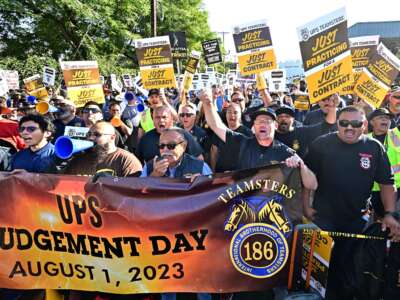 Members of the Writers Guild of America join UPS Teamsters during a rally ahead of possible UPS strike, in Los Angeles, California, on July 19, 2023.