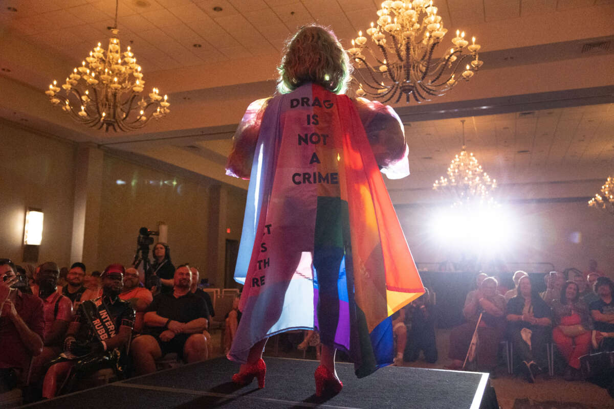 Salem Sanderson wears a cape that reads Drag is Not a Crime as she performs during the Miss Gay Days Pageant at the DoubleTree by Hilton Orlando at SeaWorld on June 3, 2023, in Orlando, Florida.