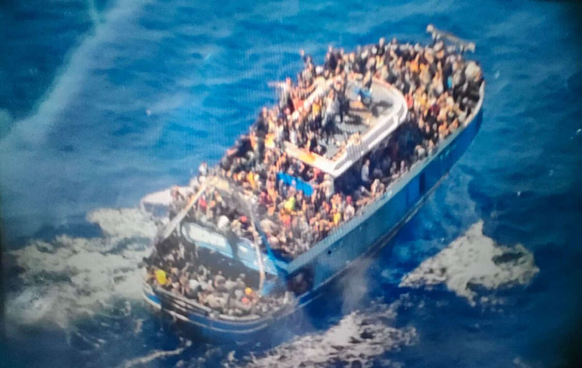 This undated handout image, provided by Greece's coast guard, appears to show an overcrowded fishing boat that later capsized and sank off the southern coast of Greece on June 14, 2023.