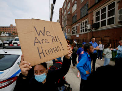 Community members protest outside the Public School 188 Michael E. Berdy at Coney Island on May 16, 2023, in Brooklyn borough of New York City, in response to New York City officials turning to at least three different schools to help house asylum seekers.