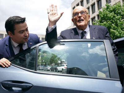 Former New York City Mayor and former personal lawyer for former President Donald Trump Rudy Giuliani (right) leaves the U.S. District Court on May 19, 2023, in Washington, D.C.