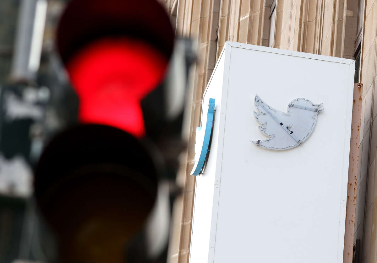 The outline of the iconic blue Twitter bird logo is visible on a sign in front of X headquarters on July 26, 2023, in San Francisco, California.