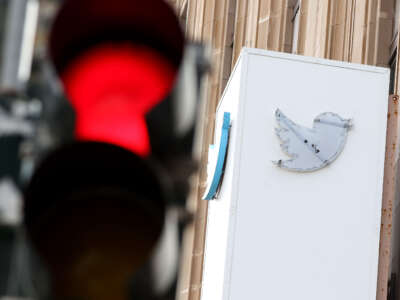 The outline of the iconic blue Twitter bird logo is visible on a sign in front of X headquarters on July 26, 2023, in San Francisco, California.